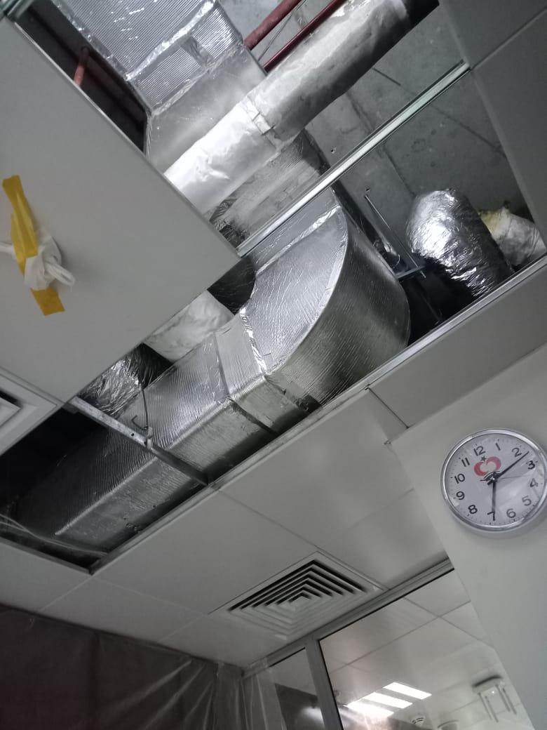Chiller unit on rooftop with engineer