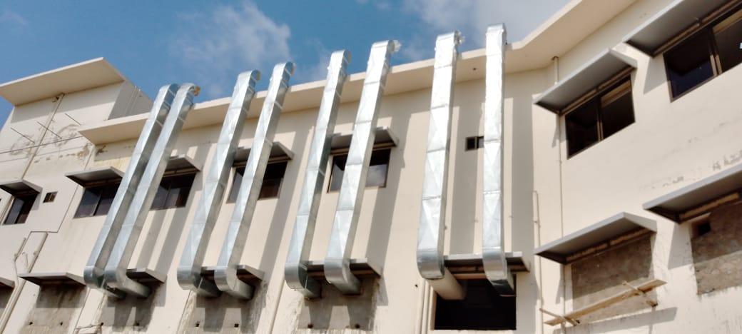 External ductwork on brick building facade